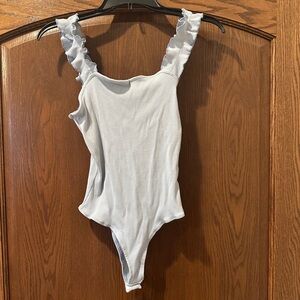 Francesca’s Joanna Ruffle Strap Bodysuit, light blue